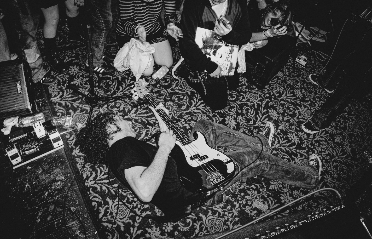 Underground crowd scene with stage lights in an Arizona venue